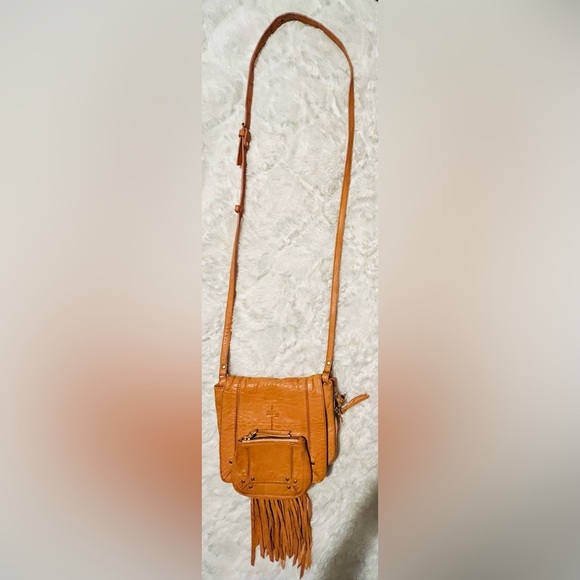 Jerome Dreyfuss Paris a tan leather crossbody bag with fringing detail